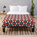 Celeste-inspired plush blanket featuring the game's iconic character Madeline and the Strawberry Sprite