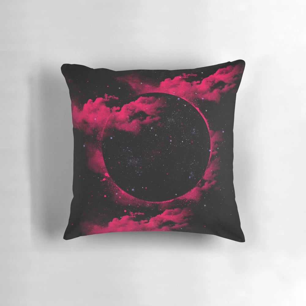 Stylish black hole-inspired pillow design featuring a pink and black space theme.