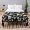 Celestial-themed plush blanket with lunar eclipse design