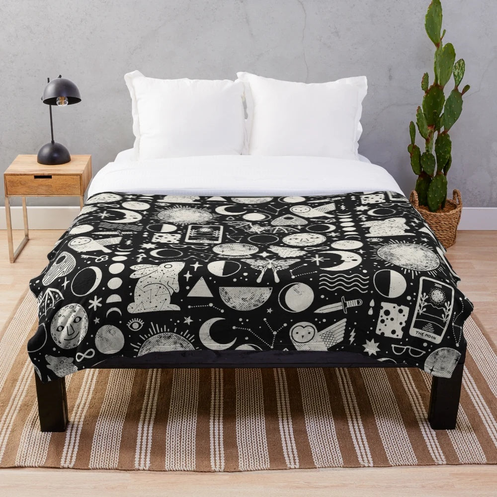 Celestial-themed plush blanket with lunar eclipse design