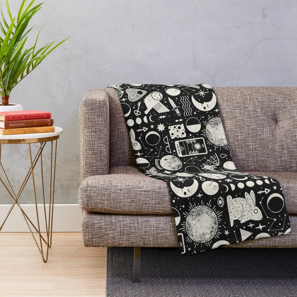 Celestial-themed plush blanket with lunar eclipse design