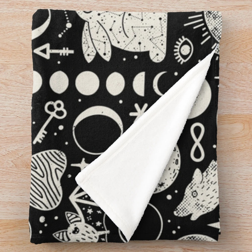 Celestial-themed plush blanket with lunar eclipse design