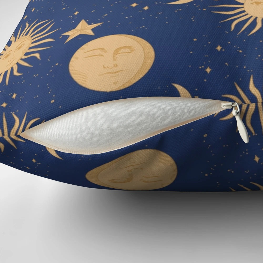 Celestial bodies pillow featuring a navy blue and gold pattern with moons, stars, and constellations