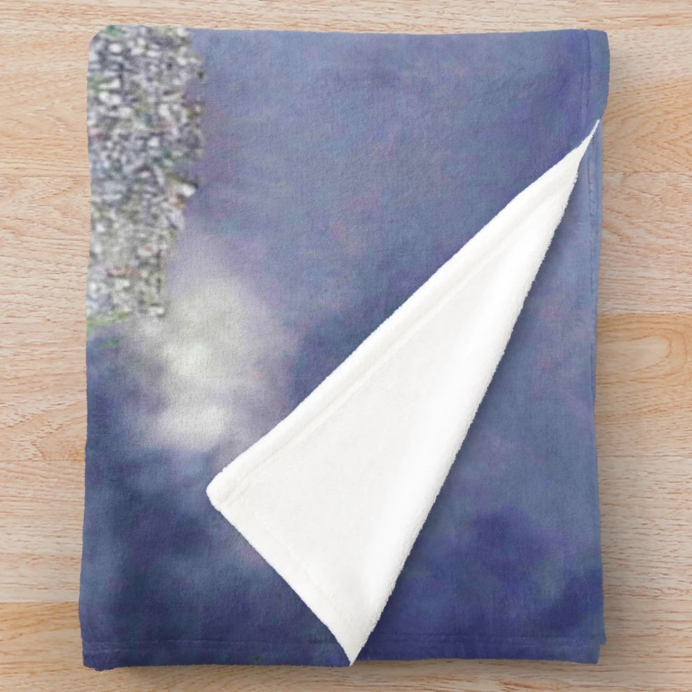 Plush blanket featuring whimsical castle in the sky design, perfect for anime and fantasy enthusiasts