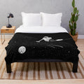 Cozy plush blanket featuring a galaxy-inspired cosmic design