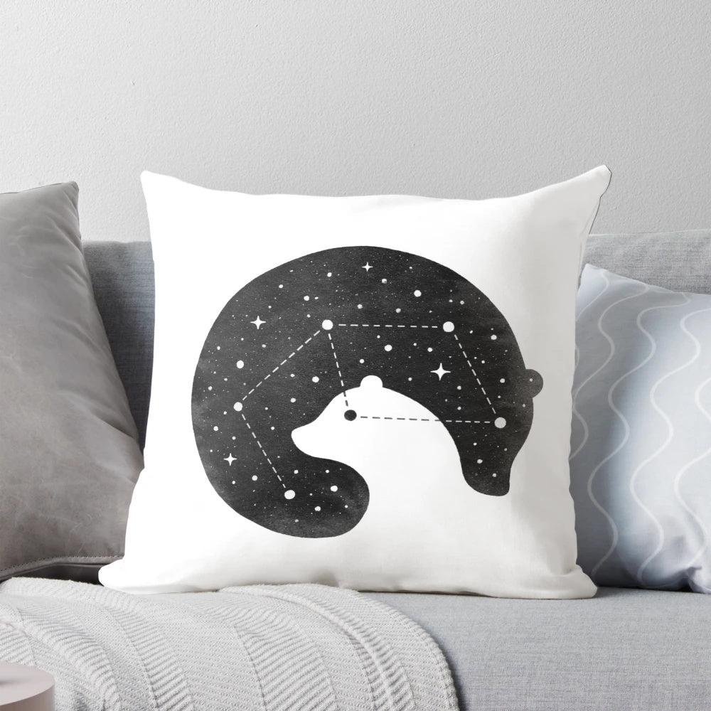 A cozy space-themed pillow featuring constellations and bears