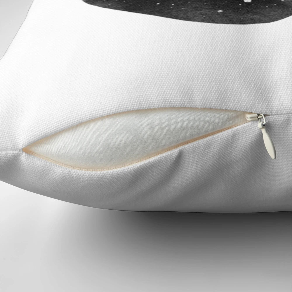 A cozy space-themed pillow featuring constellations and bears