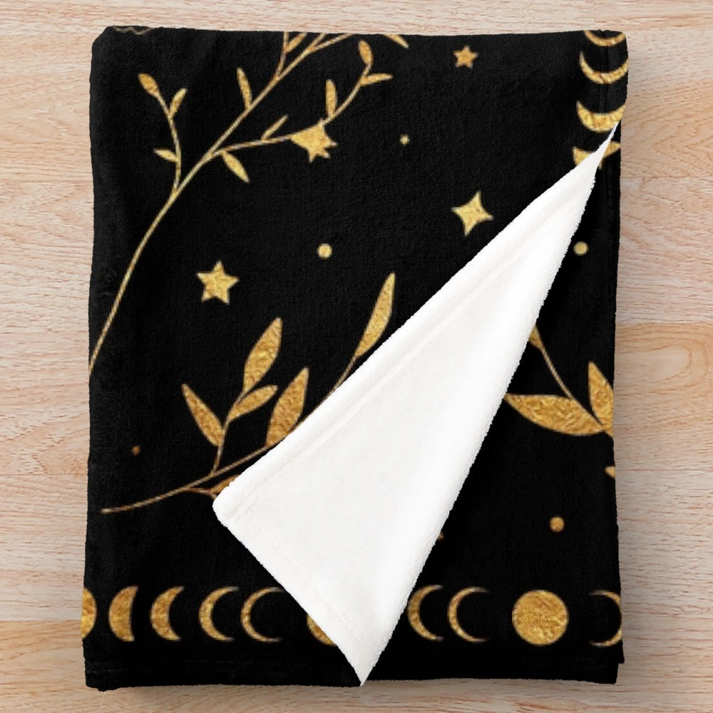 Celestial crescent moon plush blanket with floral accents and moon phases