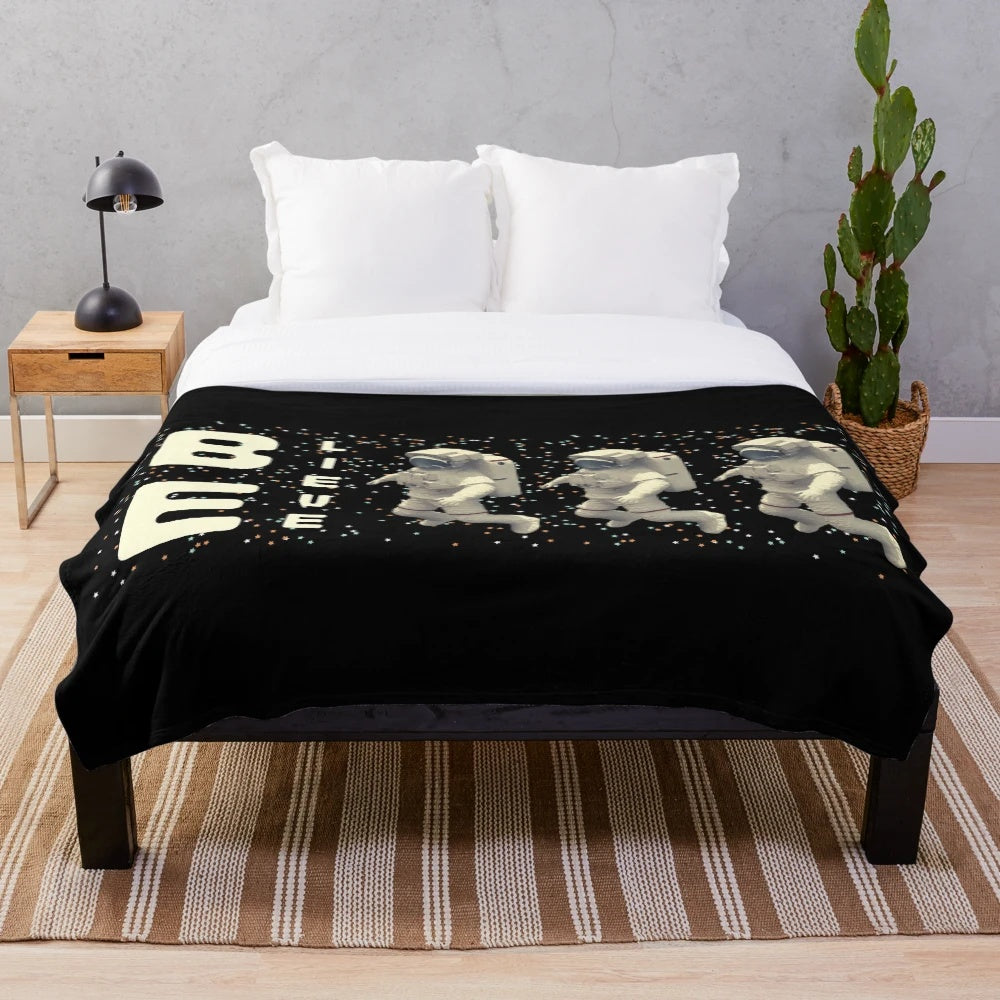 Astronaut plush blanket with galaxy and stars design