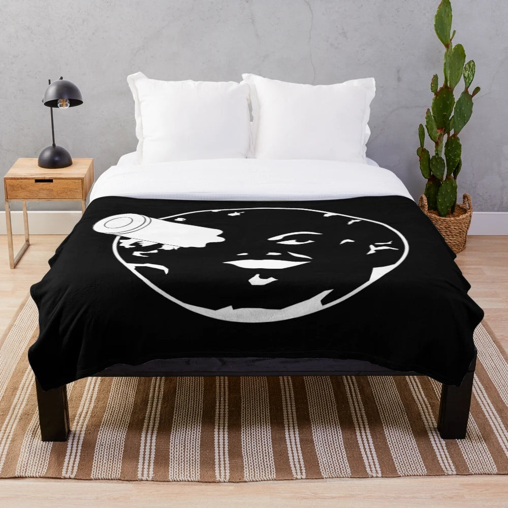 Plush blanket featuring a minimalist moon and rocket design