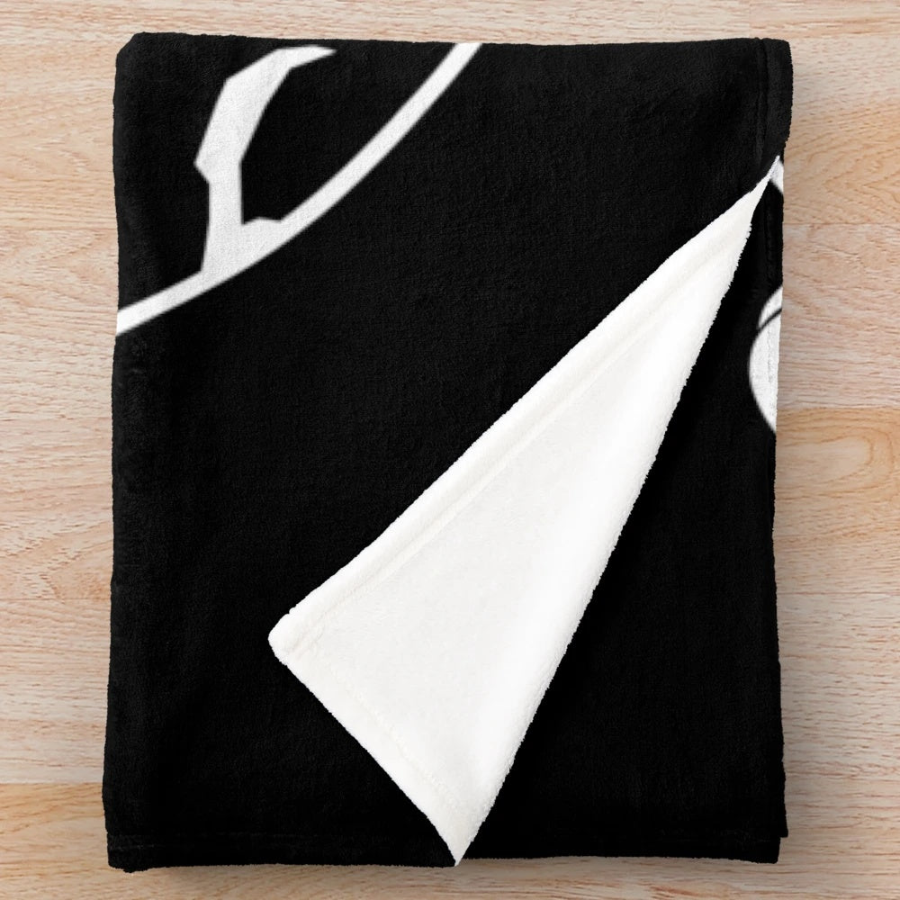 Plush blanket featuring a minimalist moon and rocket design