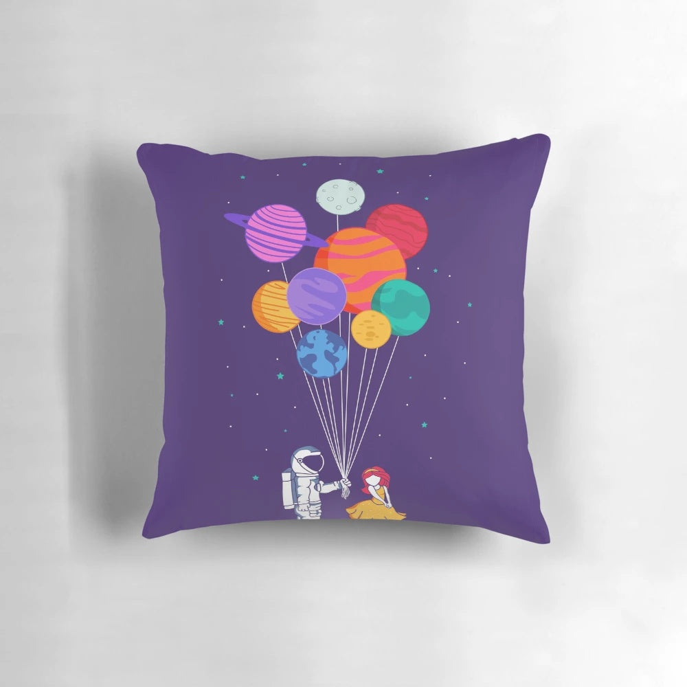 A vibrant and colorful pillow depicting a couple floating in space, surrounded by planets, stars, and galaxies.