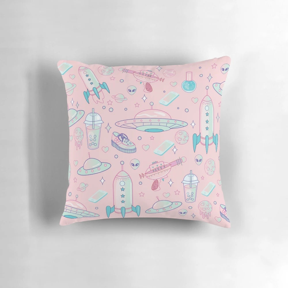 A decorative pillow with a colorful galaxy pattern and pastel goth aesthetic, perfect for adding a touch of cosmic style to your space.