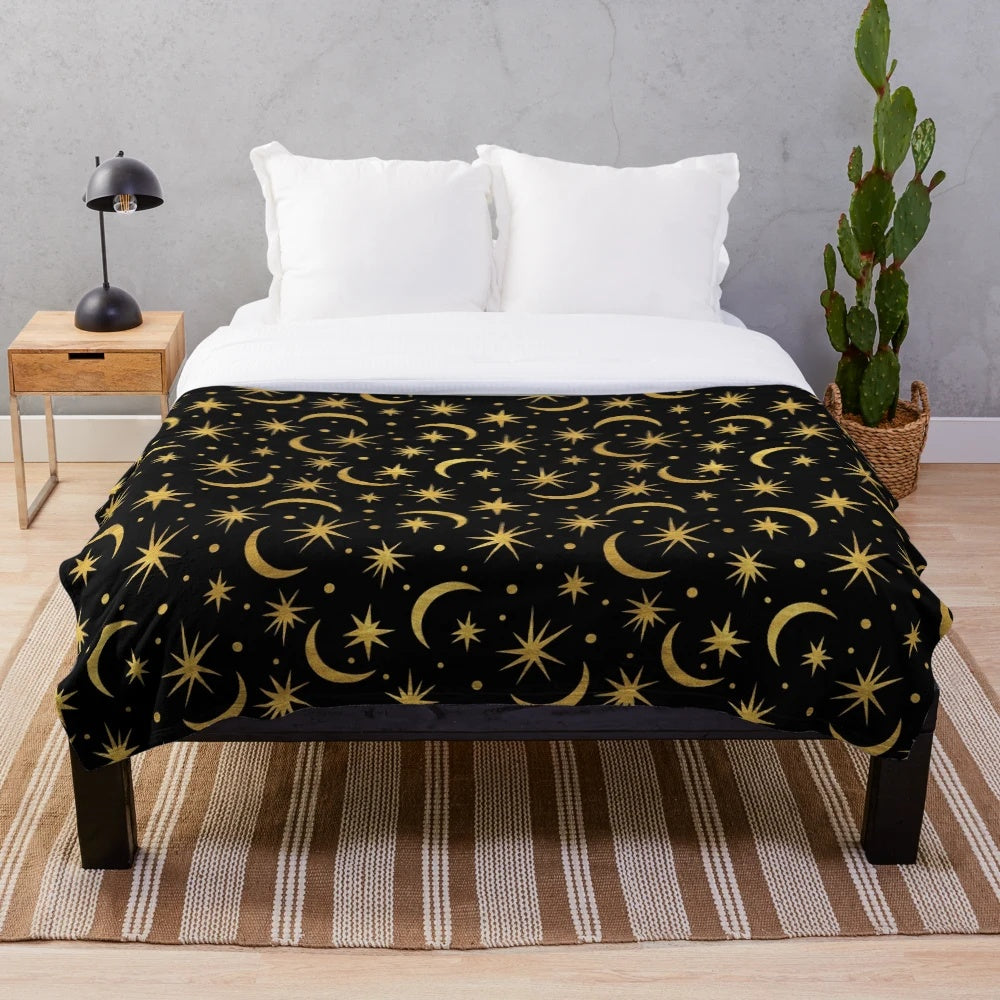 Soft and plush galaxy-themed blanket with stars, moons, and cosmic elements