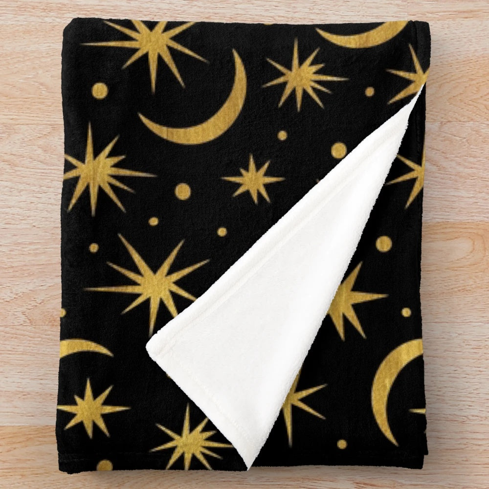Soft and plush galaxy-themed blanket with stars, moons, and cosmic elements