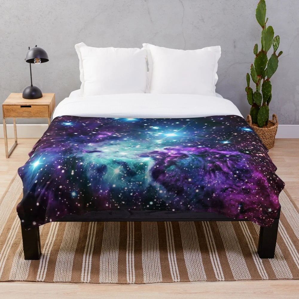 Soft and cozy plush blanket featuring a galaxy and nebula design