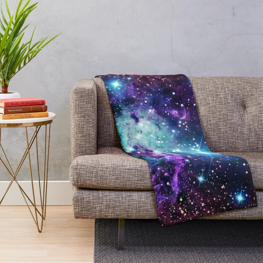 Soft and cozy plush blanket featuring a galaxy and nebula design