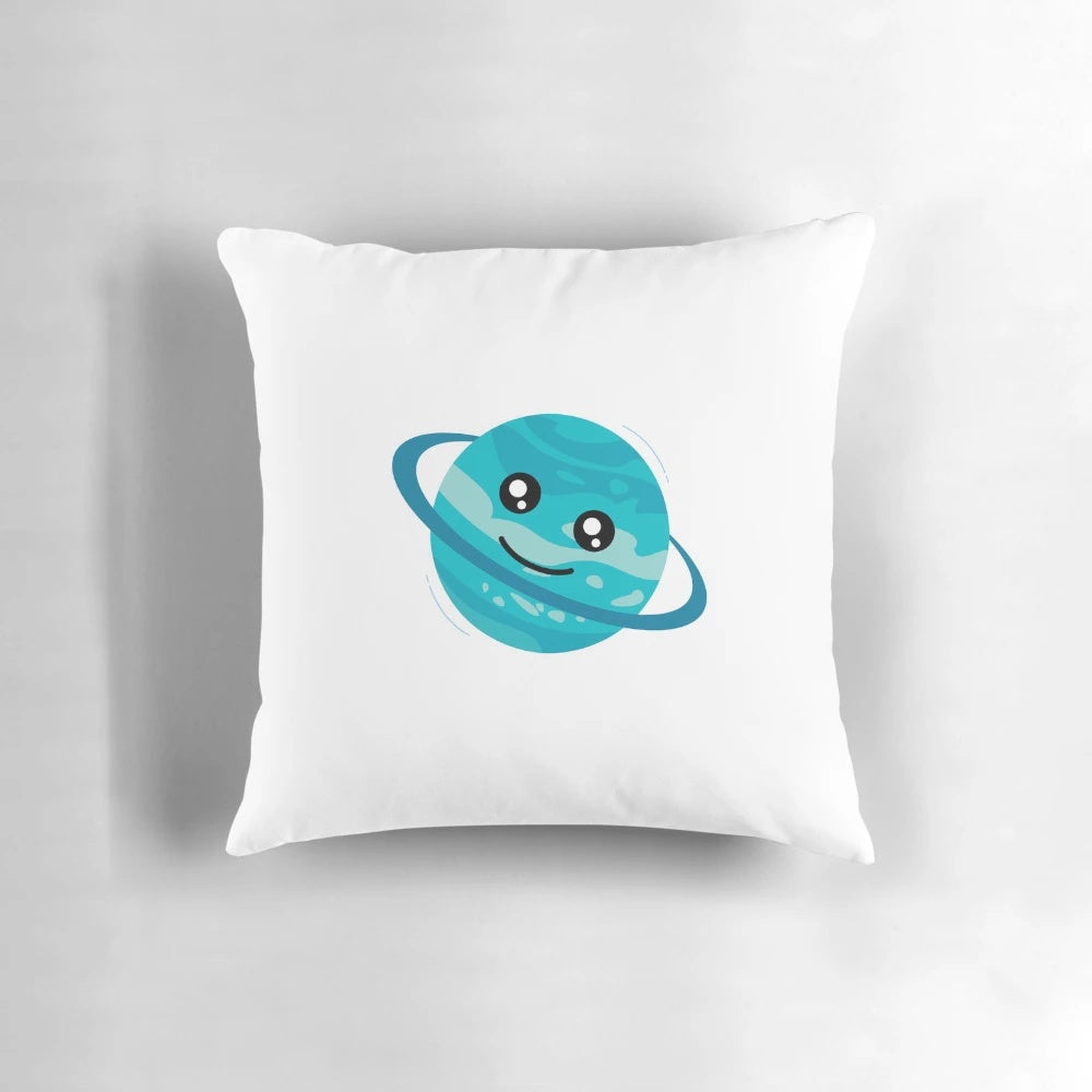 Colorful cartoon illustration of a happy planet with rings and stars on a teal blue green throw pillow