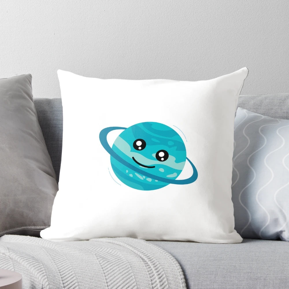 Colorful cartoon illustration of a happy planet with rings and stars on a teal blue green throw pillow
