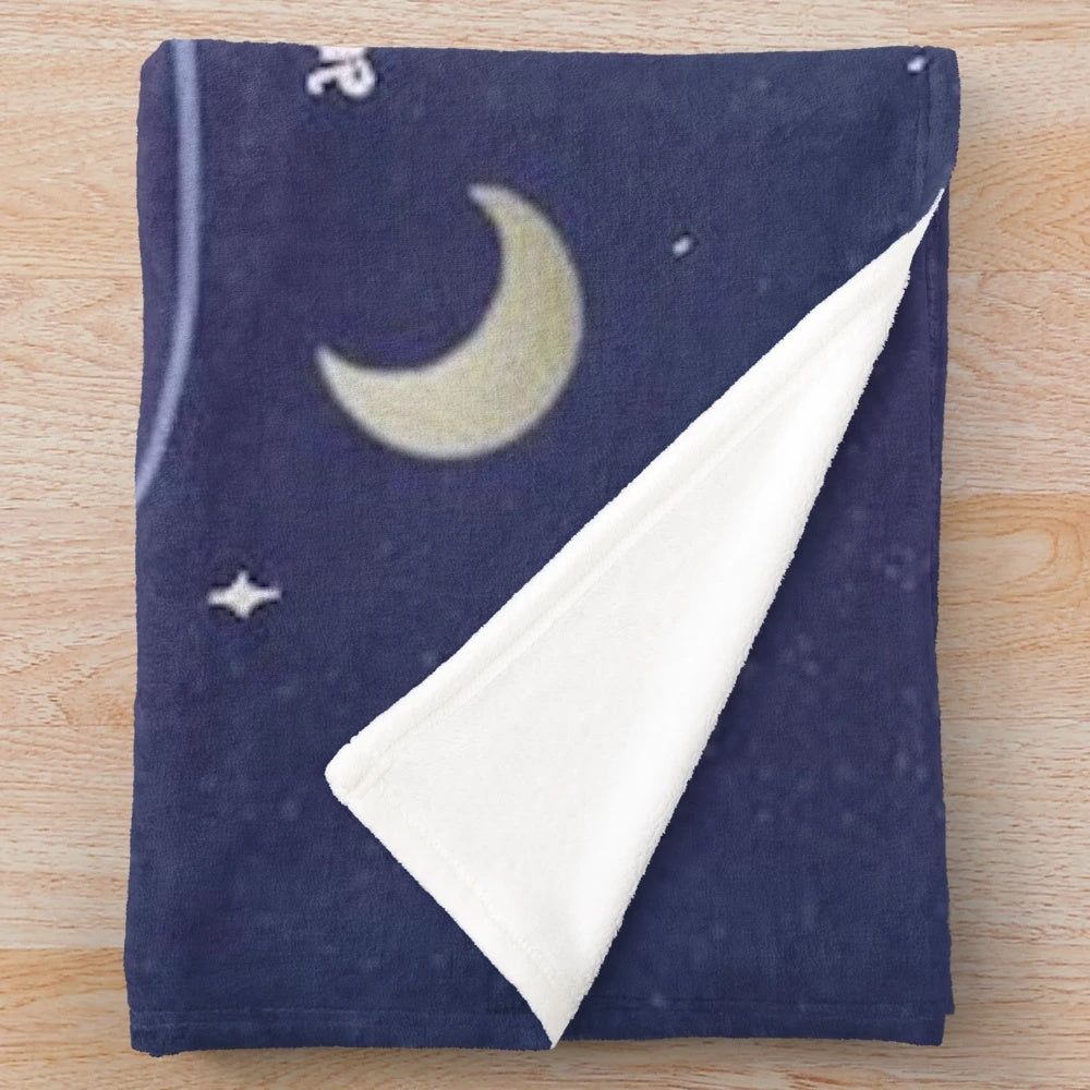 Celestial-inspired plush blanket with moon phase and sun and moon design