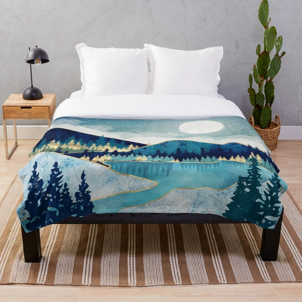 Calming and serene plush blanket with a celestial nature-inspired design