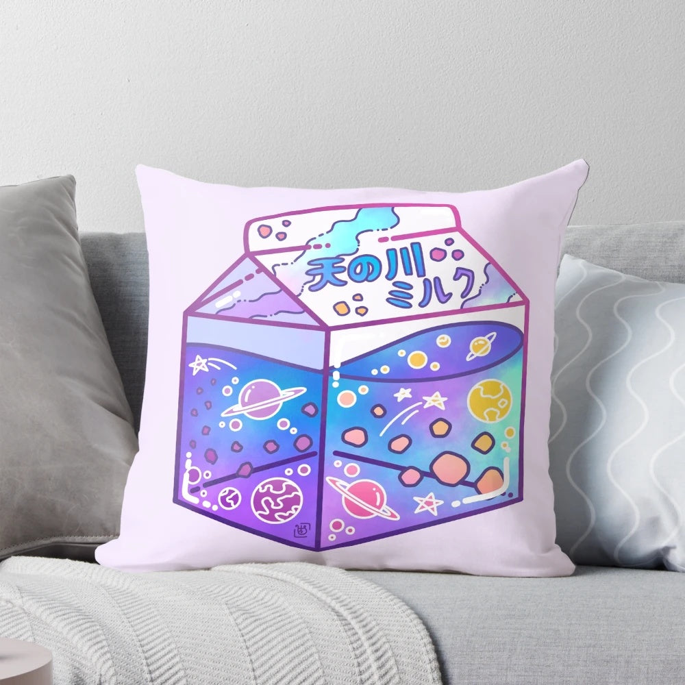 A colorful, glow-in-the-dark pillow featuring a Milky Way galaxy and milk carton design, perfect for creating a cozy, cosmic ambiance.