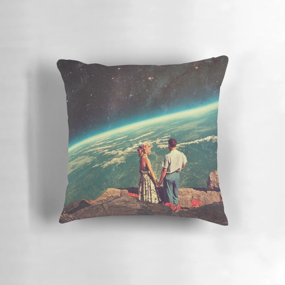 A beautiful digital collage pillow featuring a couple embracing under a starry, cosmic sky with planets and flowers.