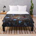 Soft and cuddly plush blanket with a galaxy-inspired manta ray design
