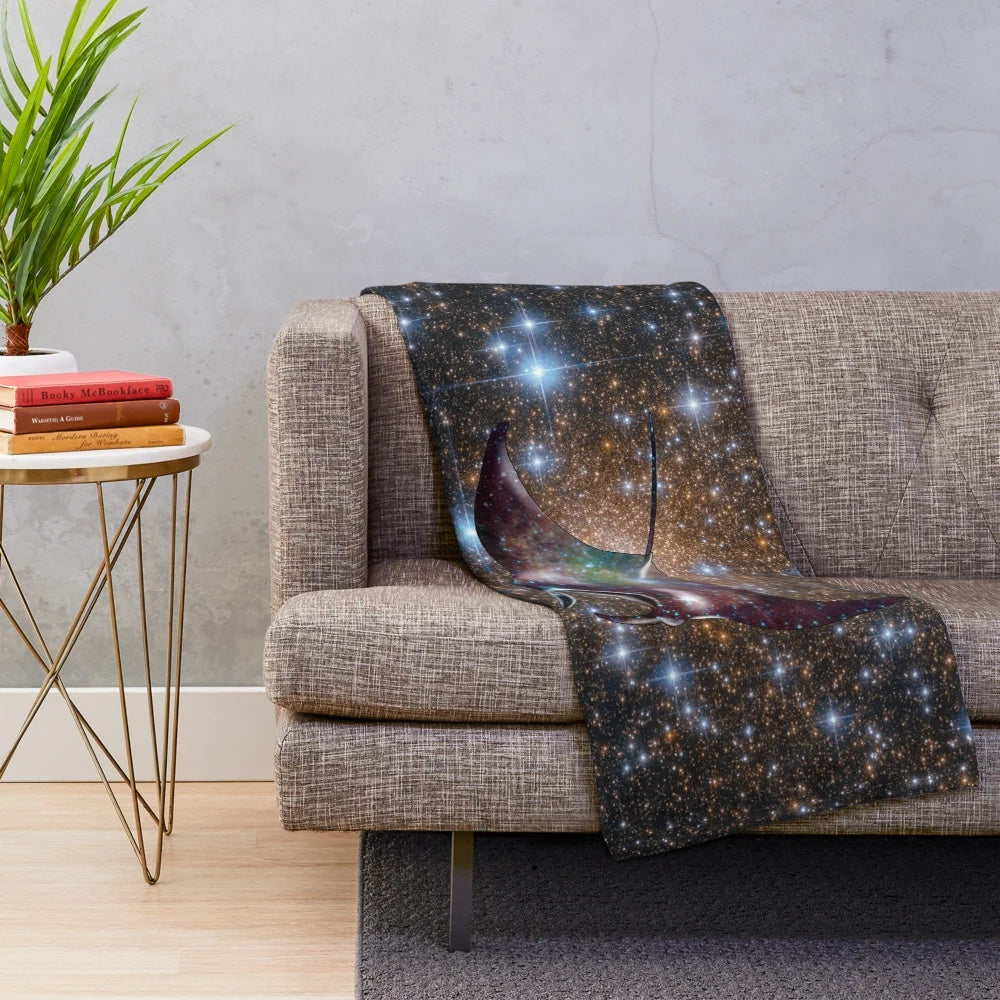 Soft and cuddly plush blanket with a galaxy-inspired manta ray design