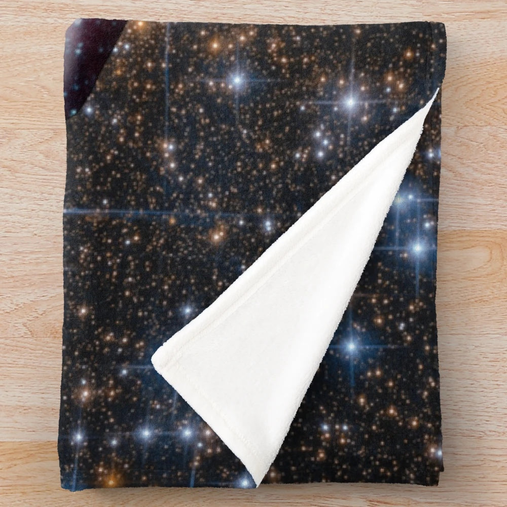 Soft and cuddly plush blanket with a galaxy-inspired manta ray design