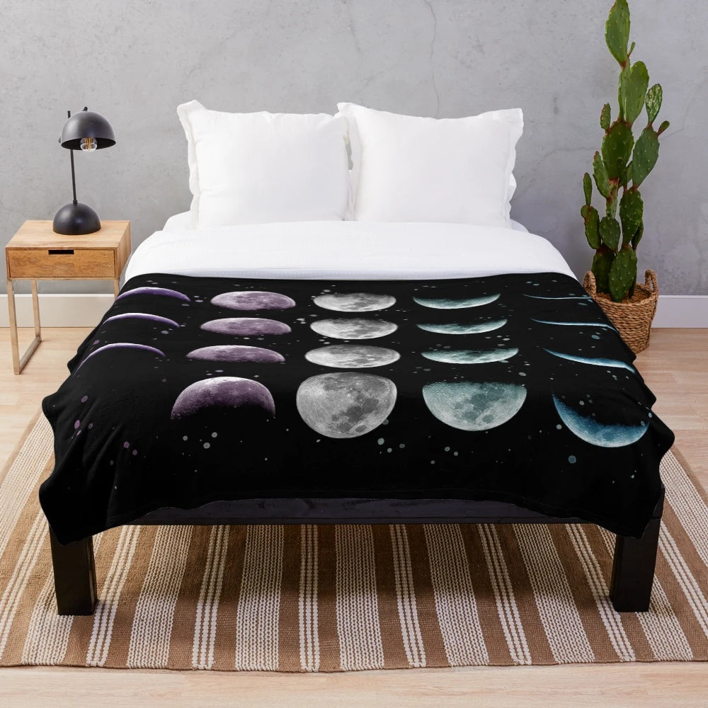 Cozy plush blanket with moon phases and celestial design