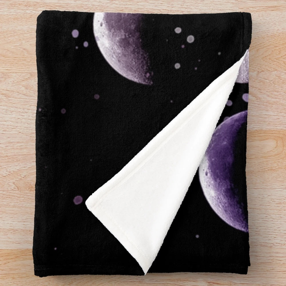 Cozy plush blanket with moon phases and celestial design