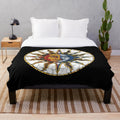 Colorful celestial plush blanket with sun and moon mosaic pattern