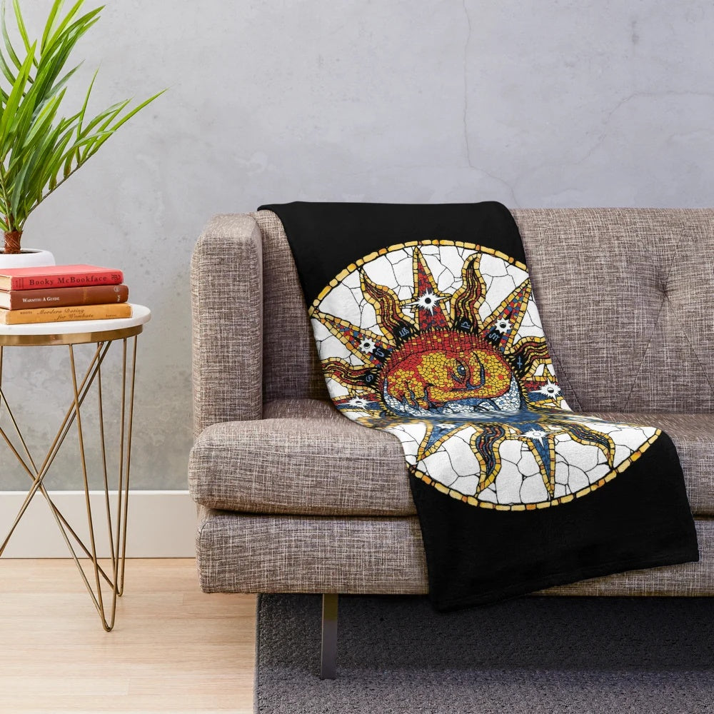 Colorful celestial plush blanket with sun and moon mosaic pattern