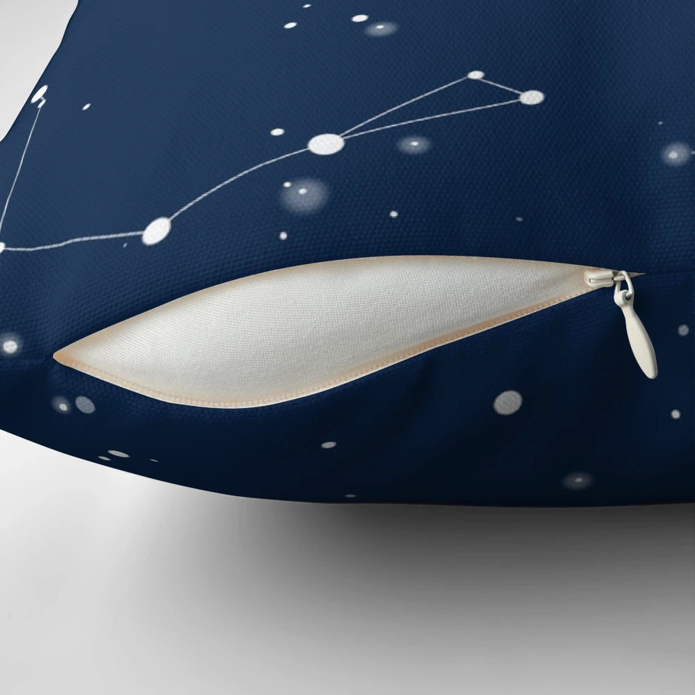 A navy blue pillow featuring a captivating night sky design with star constellations and the north star.