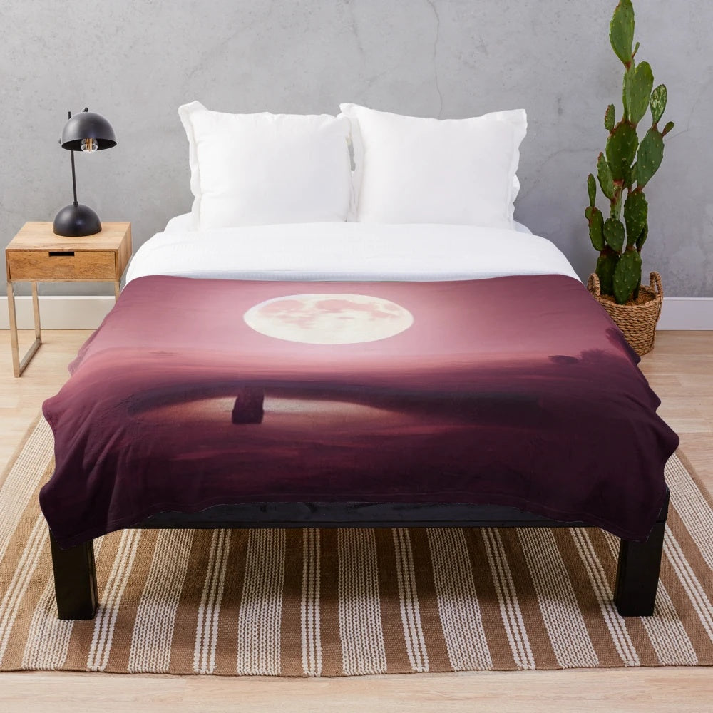 Plush blanket featuring a moon from another planet design, perfect for cinema and movie lovers