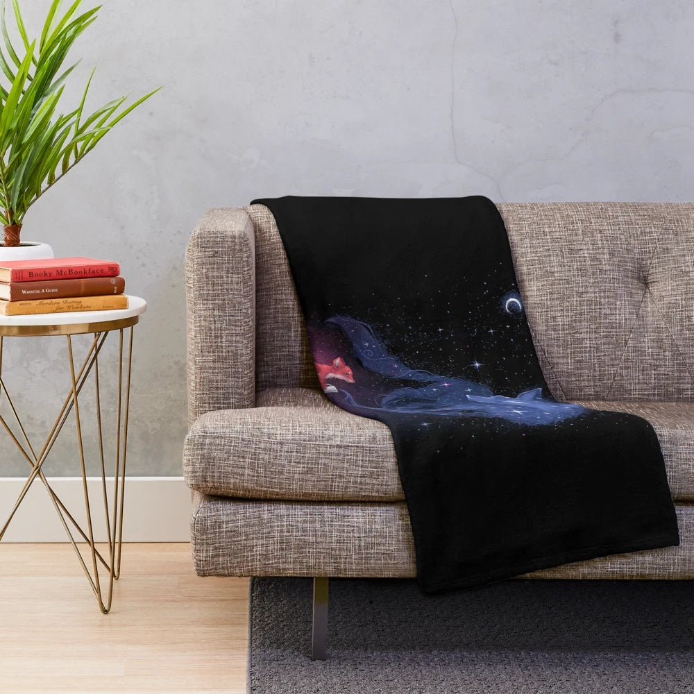 Celestial plush blanket with stars, moon, and fantasy creatures