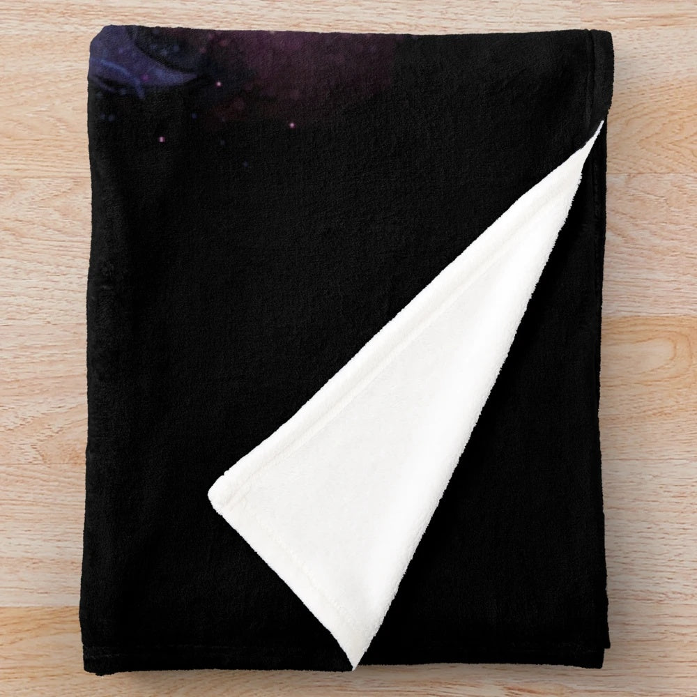 Celestial plush blanket with stars, moon, and fantasy creatures