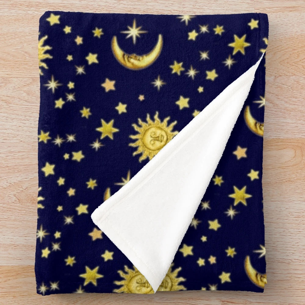 Celestial-themed plush blanket with sun, moon, and stars design