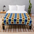 Soft and cozy plush blanket featuring a celestial design of the sun and moon