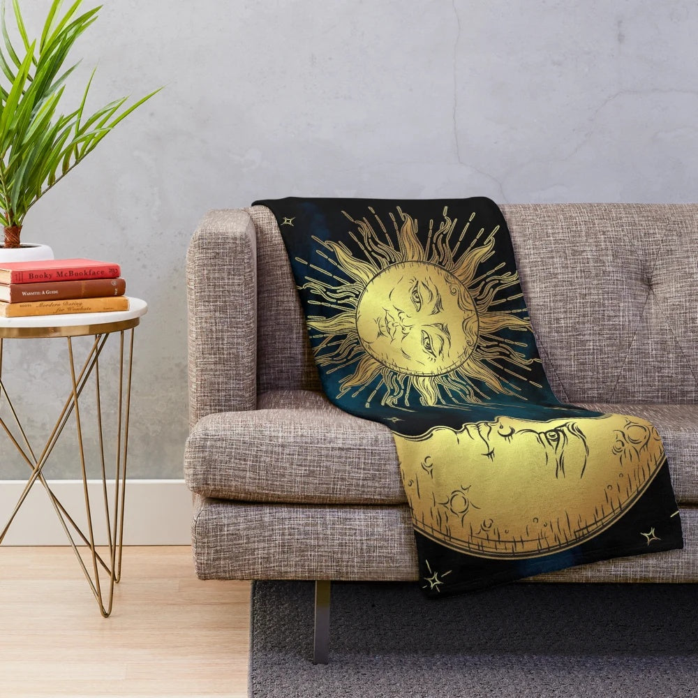 Cozy plush blanket with a celestial night sky design featuring the sun, moon, and stars