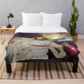 Plush blanket with a sci-fi, space-themed design featuring astronauts, planets, and a colorful galaxy