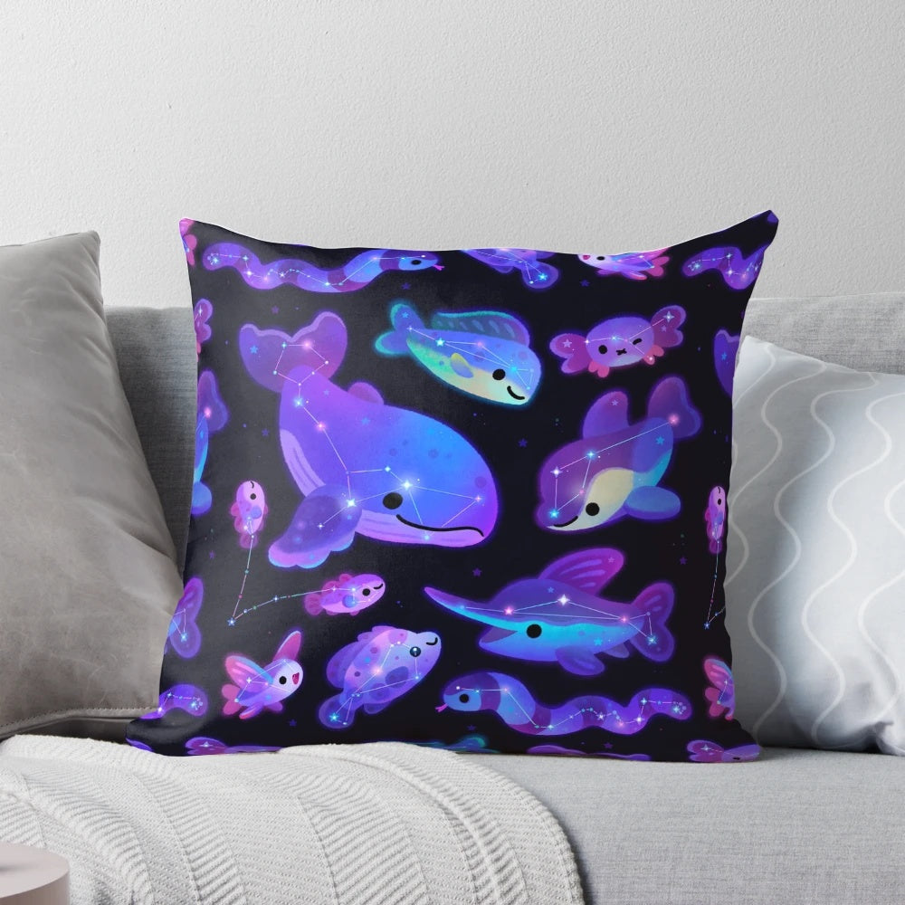 A decorative pillow featuring a design of ocean-themed constellations and marine life.