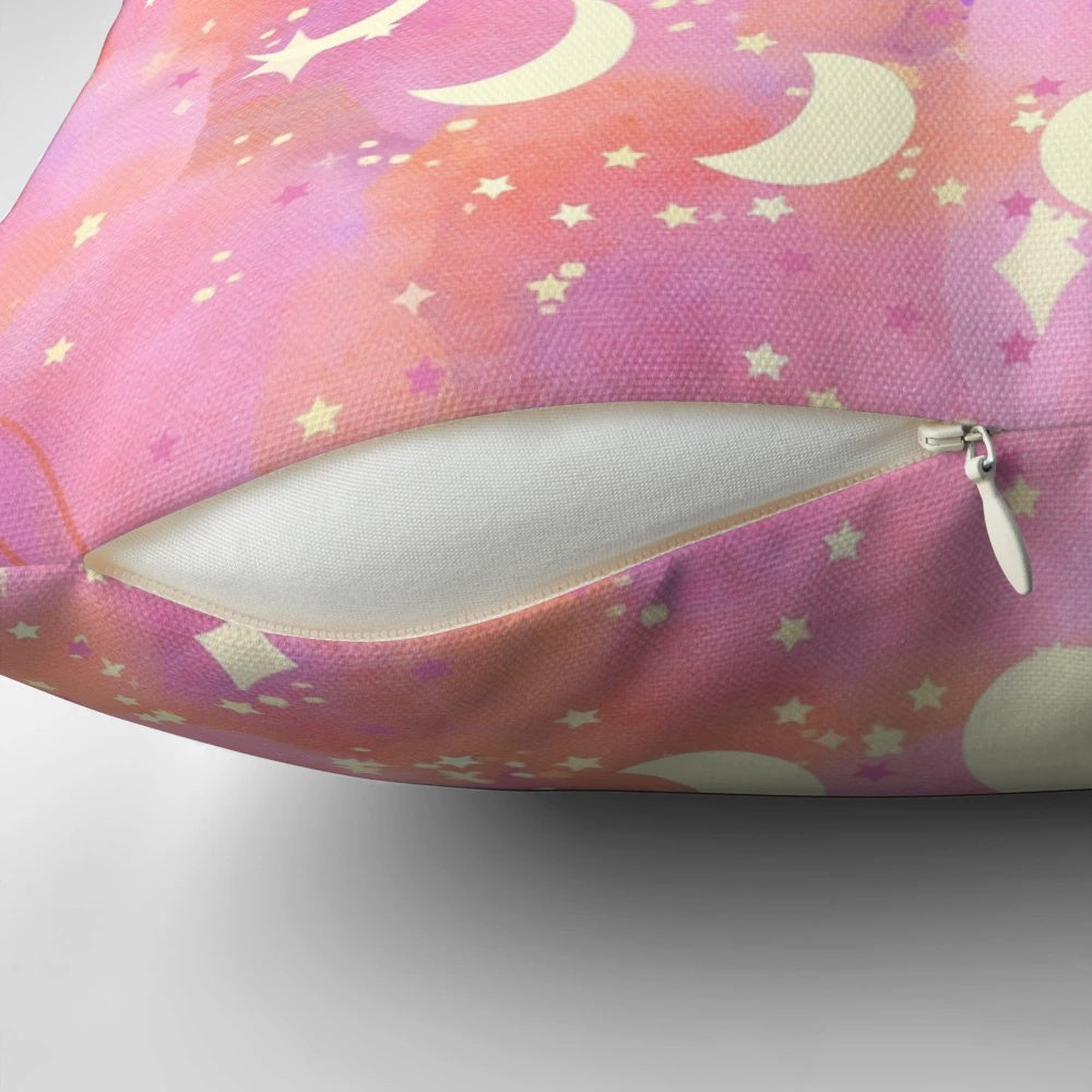 Decorative celestial-themed pink pillow with stars, sun, and moon design