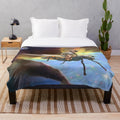 Plush blanket featuring a space cowboy design with cosmic and retro elements