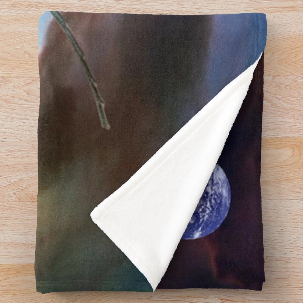 Plush blanket featuring a space cowboy design with cosmic and retro elements