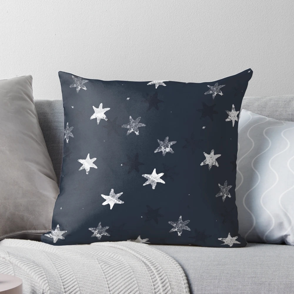 Stamped star patterned decorative pillow for a cozy bedroom or living room.