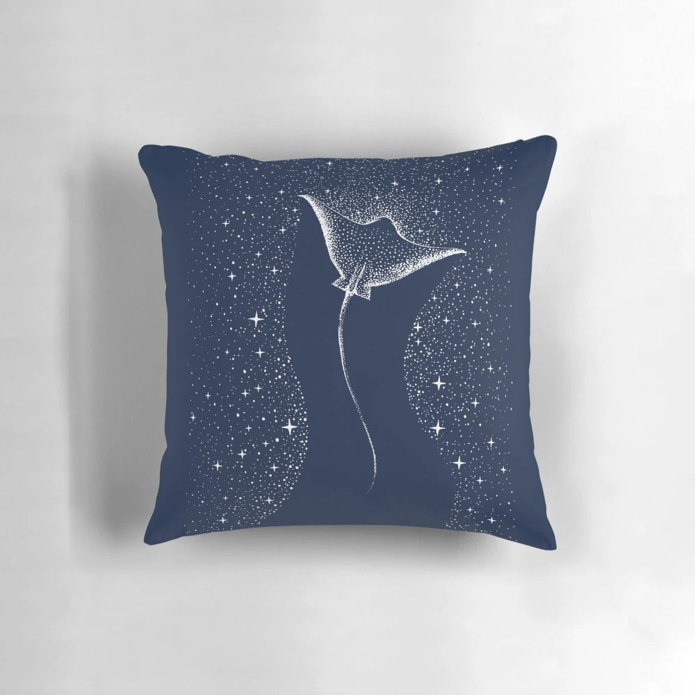 A serene and artsy pillow featuring a spotted eagle ray swimming amongst the stars and galaxies of the cosmos.
