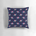 A plush, galaxy-inspired pillow featuring a whimsical design of Saturn's rings made of sweet, chocolate-coated doughnuts against a backdrop of stars.
