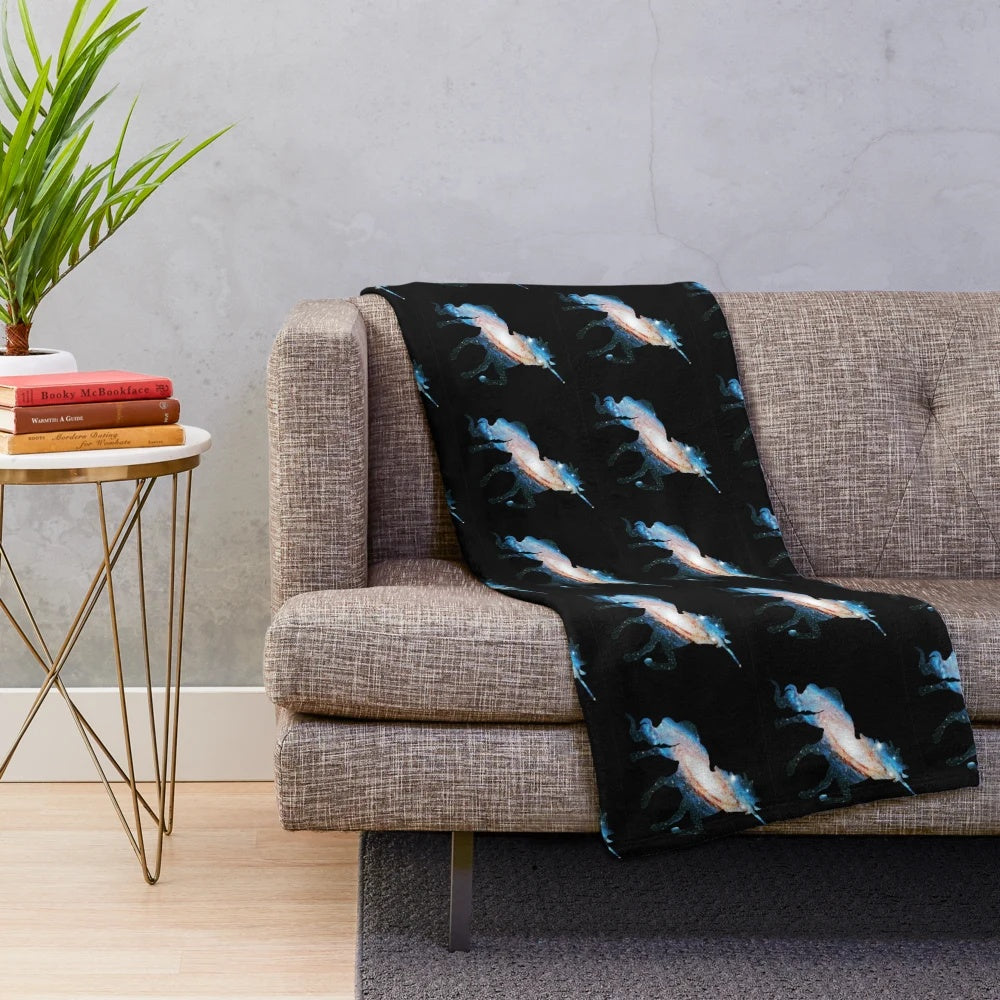 Soft, plush blanket featuring a magical unicorn silhouette against a starry galaxy background